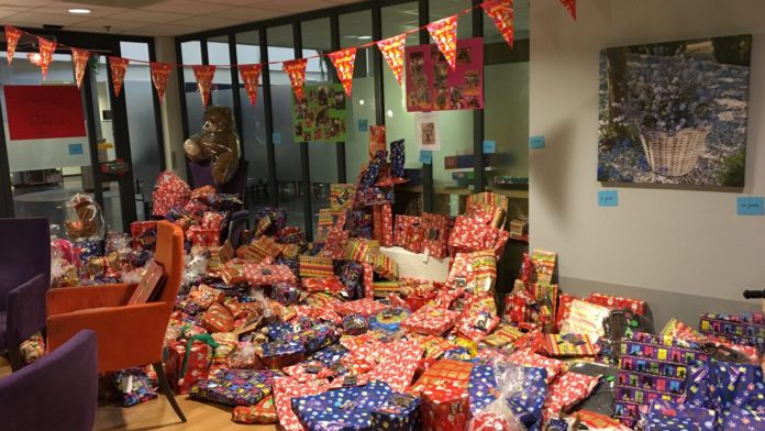 elderly people collecting gifts, for children, Vitalis, In Eindhoven.