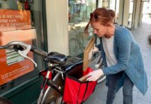 Booksellers delivering books on cycle to clients