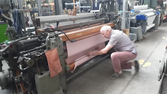 Man using weaving machine