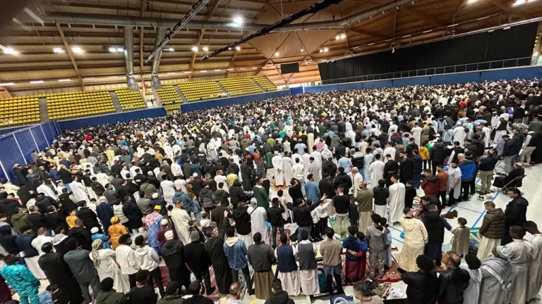 Thousands of Muslims pray together in celebration of first day of Eid-al-Fitr